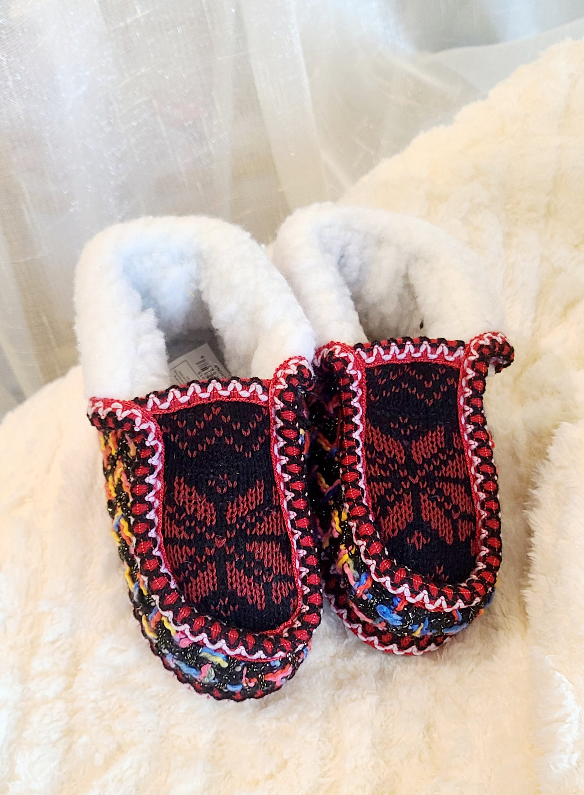 Kids dark red and colorful knit sherpa moccasin slippers, top view