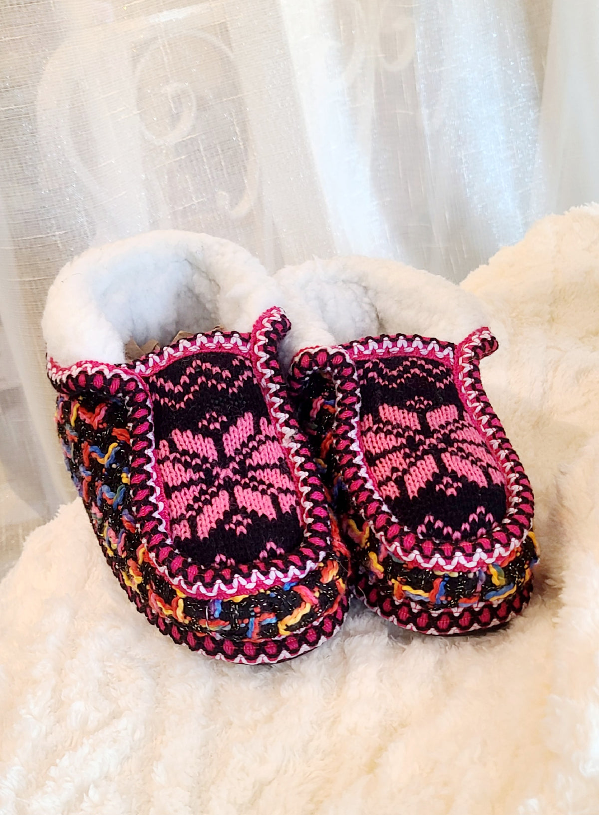 Kids fuchsia and colorful knit sherpa moccasin slippers, top view