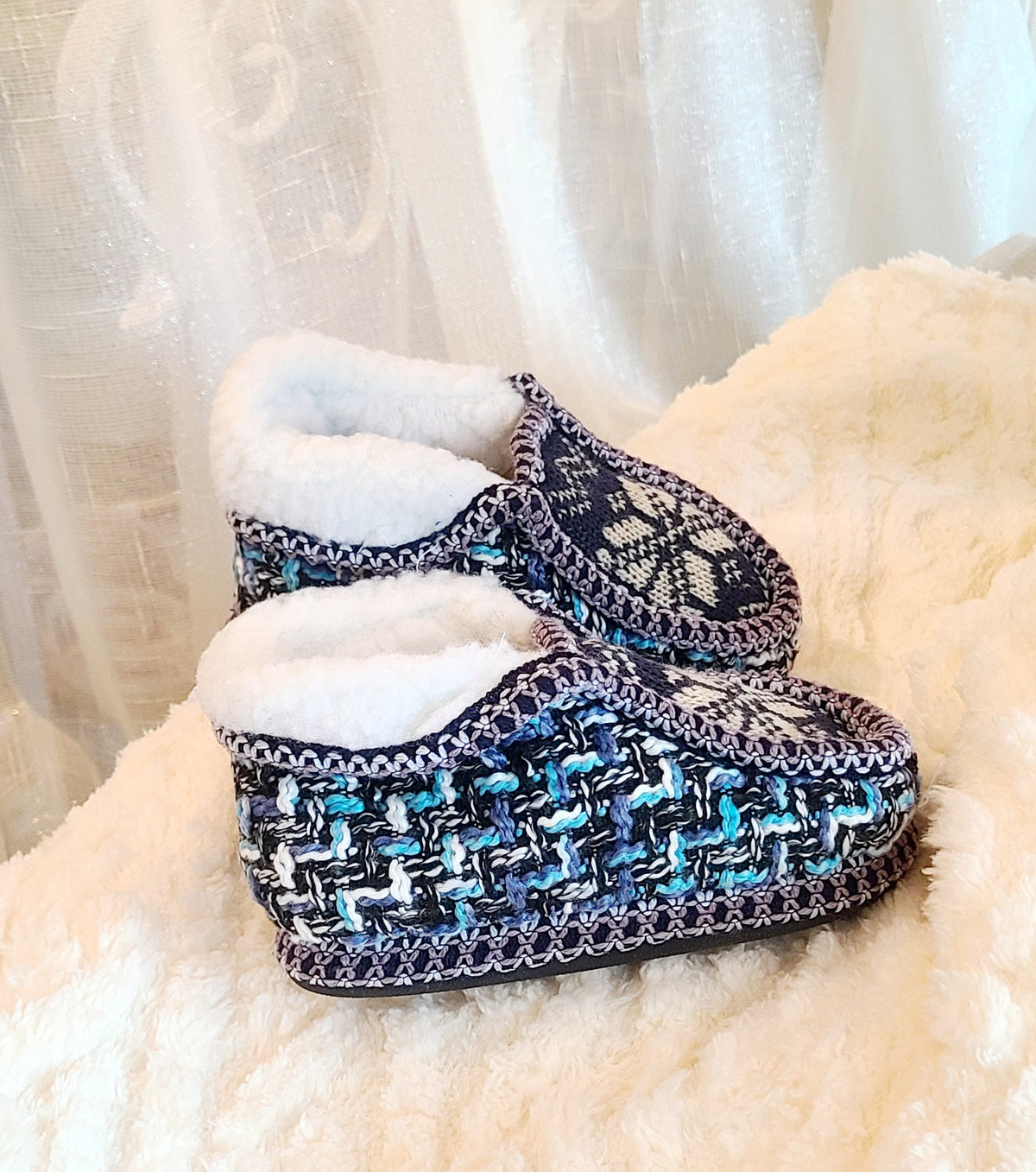 Kids tan and blue knit sherpa moccasin slippers, side view, close-up