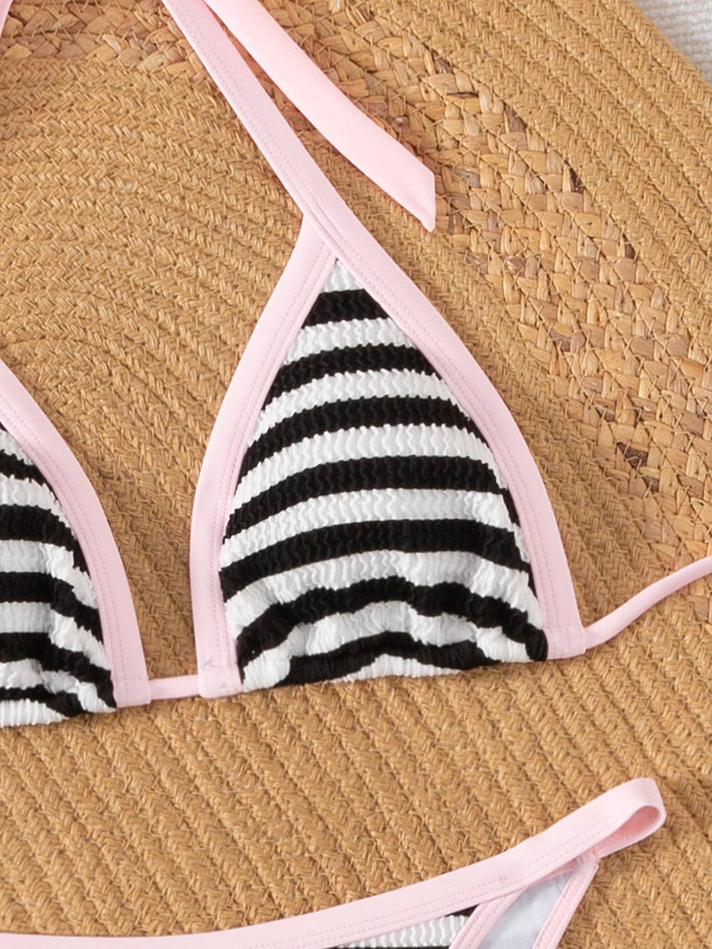 Women's and teens black and white stripe bikini with pink trim, top detail
