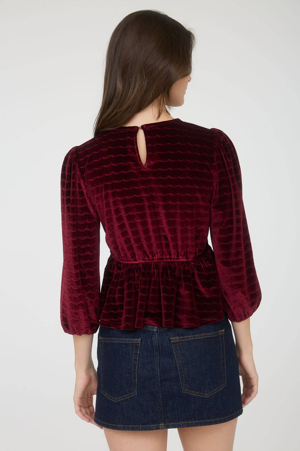 Women's velvet peplum top with pearl buttons, burgundy, back view