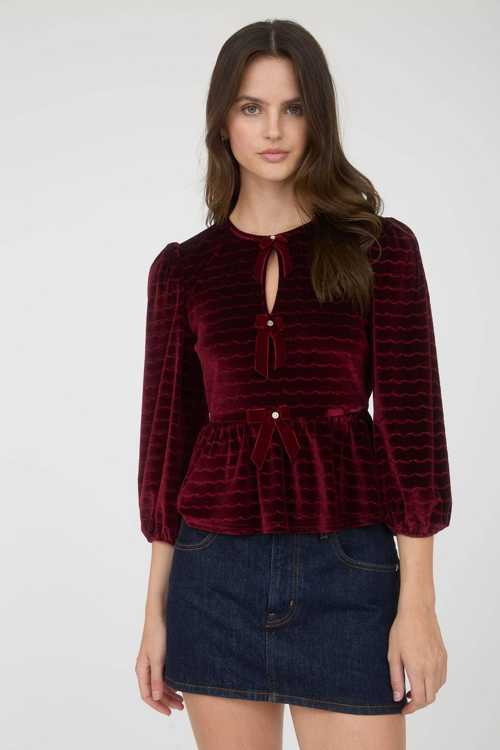 Women's velvet peplum top with pearl buttons, burgundy, front detail