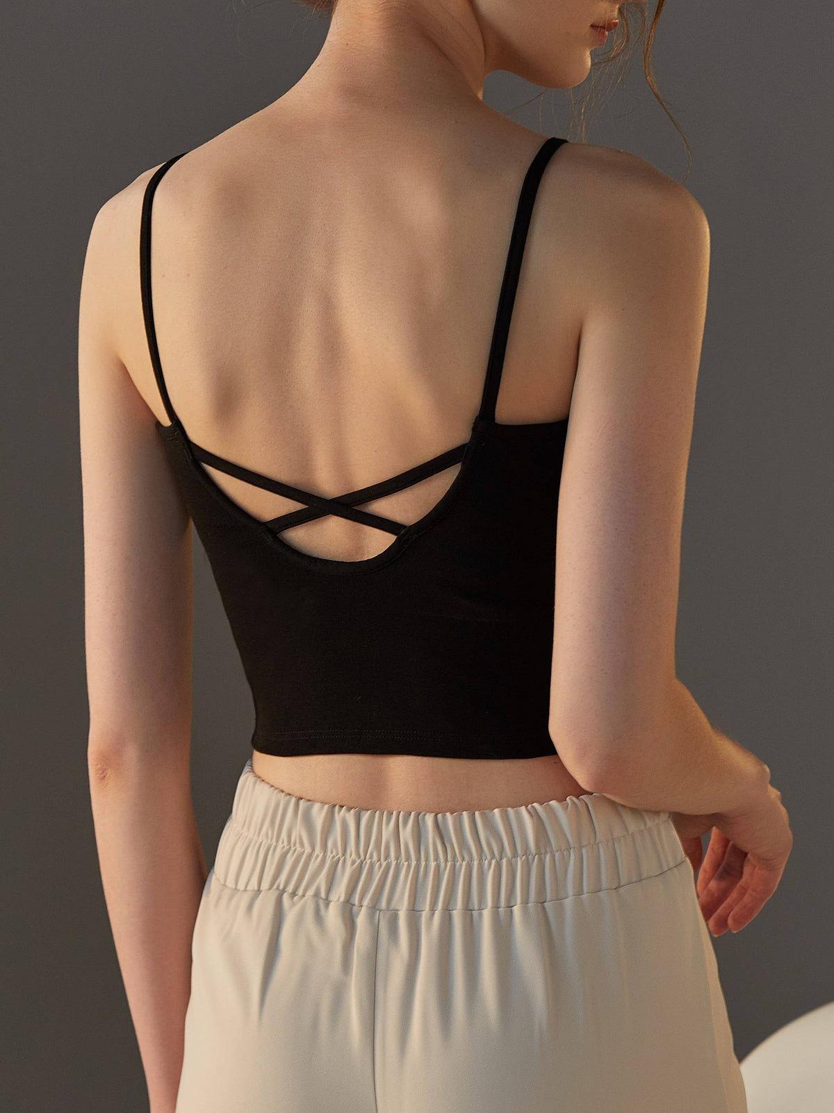 Women's built-in bra criss cross tank top, black, back view