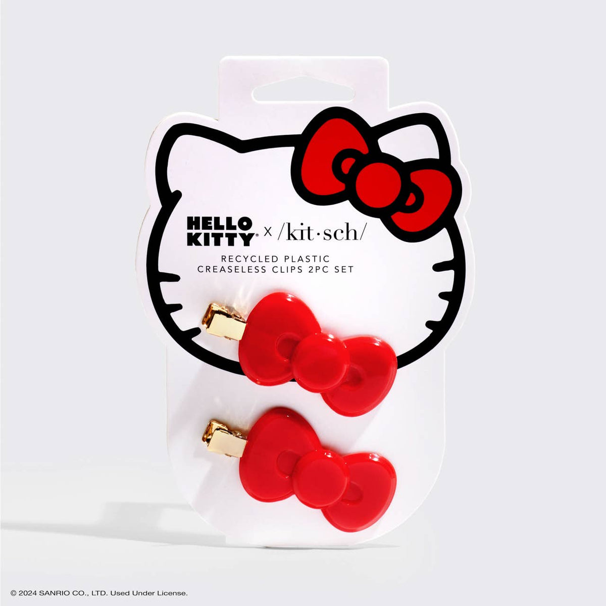 Kitsch x Hello Kitty red bow hair clips, on the card