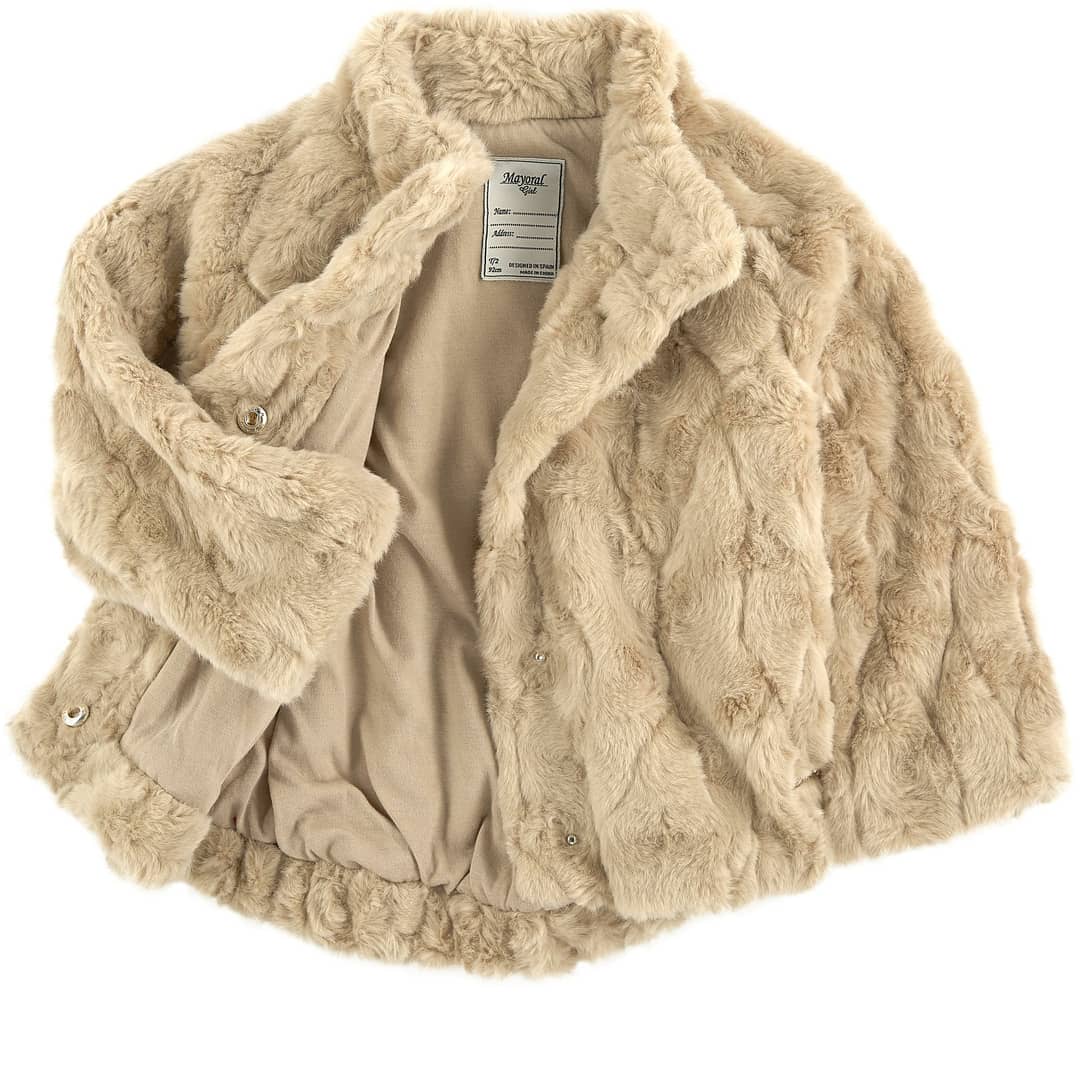 Little girl wearing the Mayoral 4461 champagne faux fur opera coat