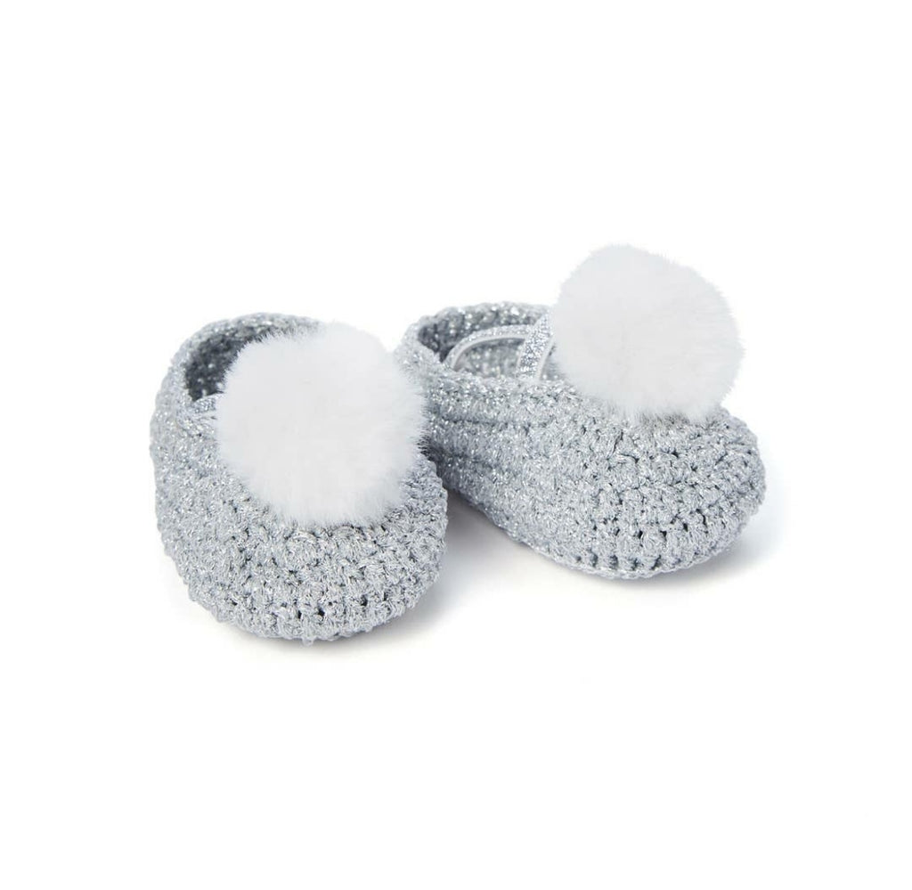 Crochet baby booties with pompom, top view