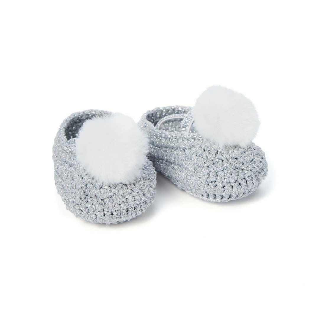 Crochet baby booties with pompom, top view