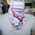 Bandana style face covering, red grey white geo print, worn by model