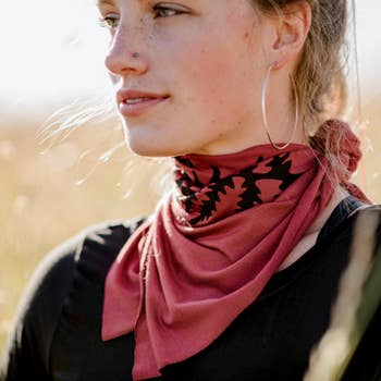 Women's hand-printed jersey bandana, black fern cinnamon, worn as neck scarf