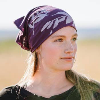 Women's hand-printed jersey bandana, white laurel plum, worn as head wrap