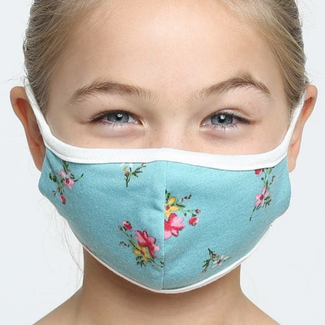 Kids cotton face mask, aqua tea floral, worn by child