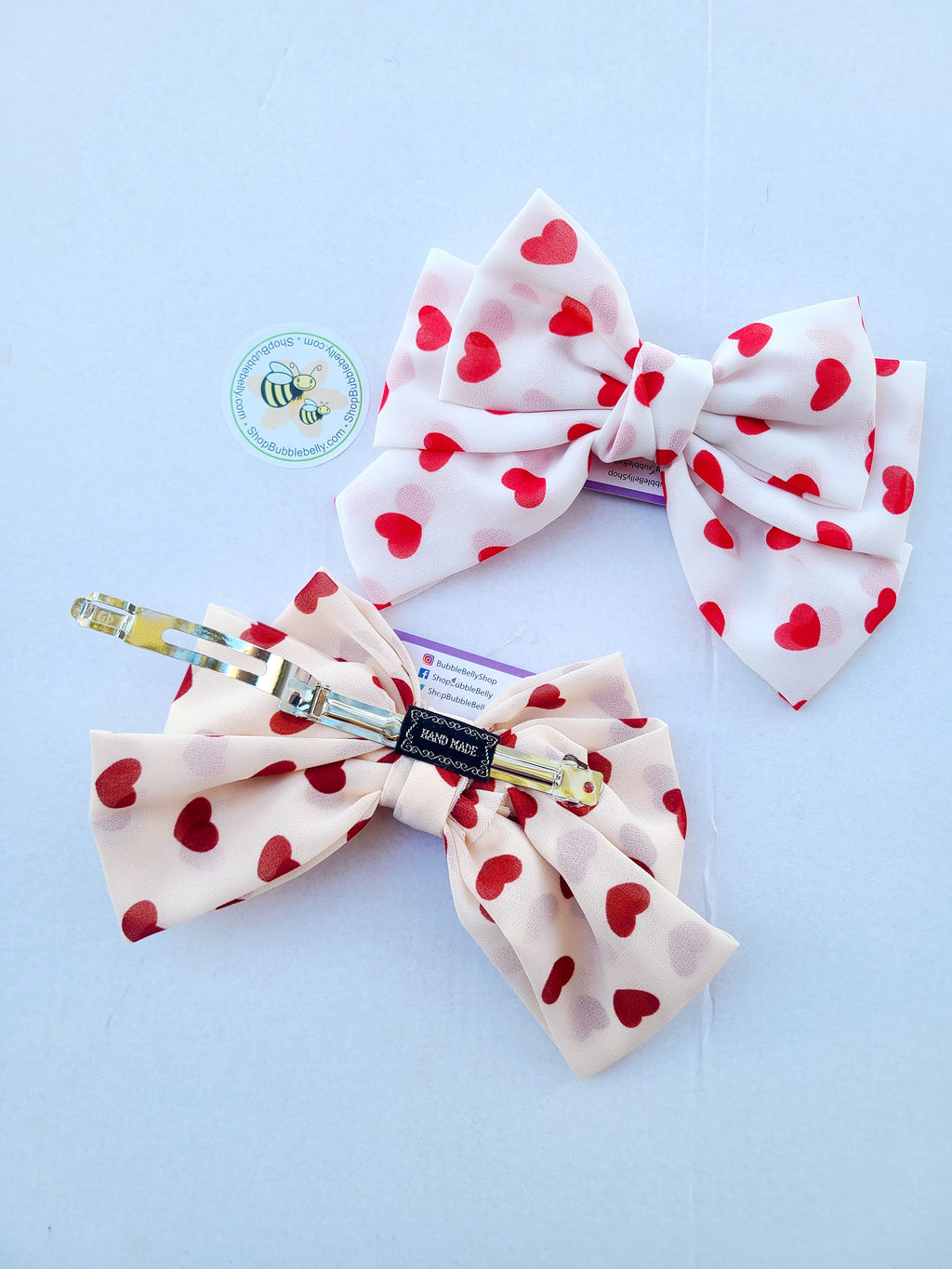XL 7 inch red heart chiffon cheer bow hair clip, two bows, side view